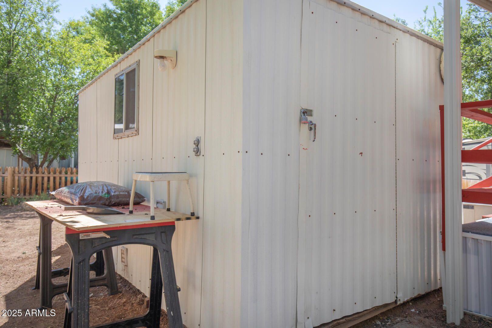 16 North Star Vale Road, Unit 11 Star Valley, AZ 85541 - Photo 21 of 24 a backyard of a house with table and chairs