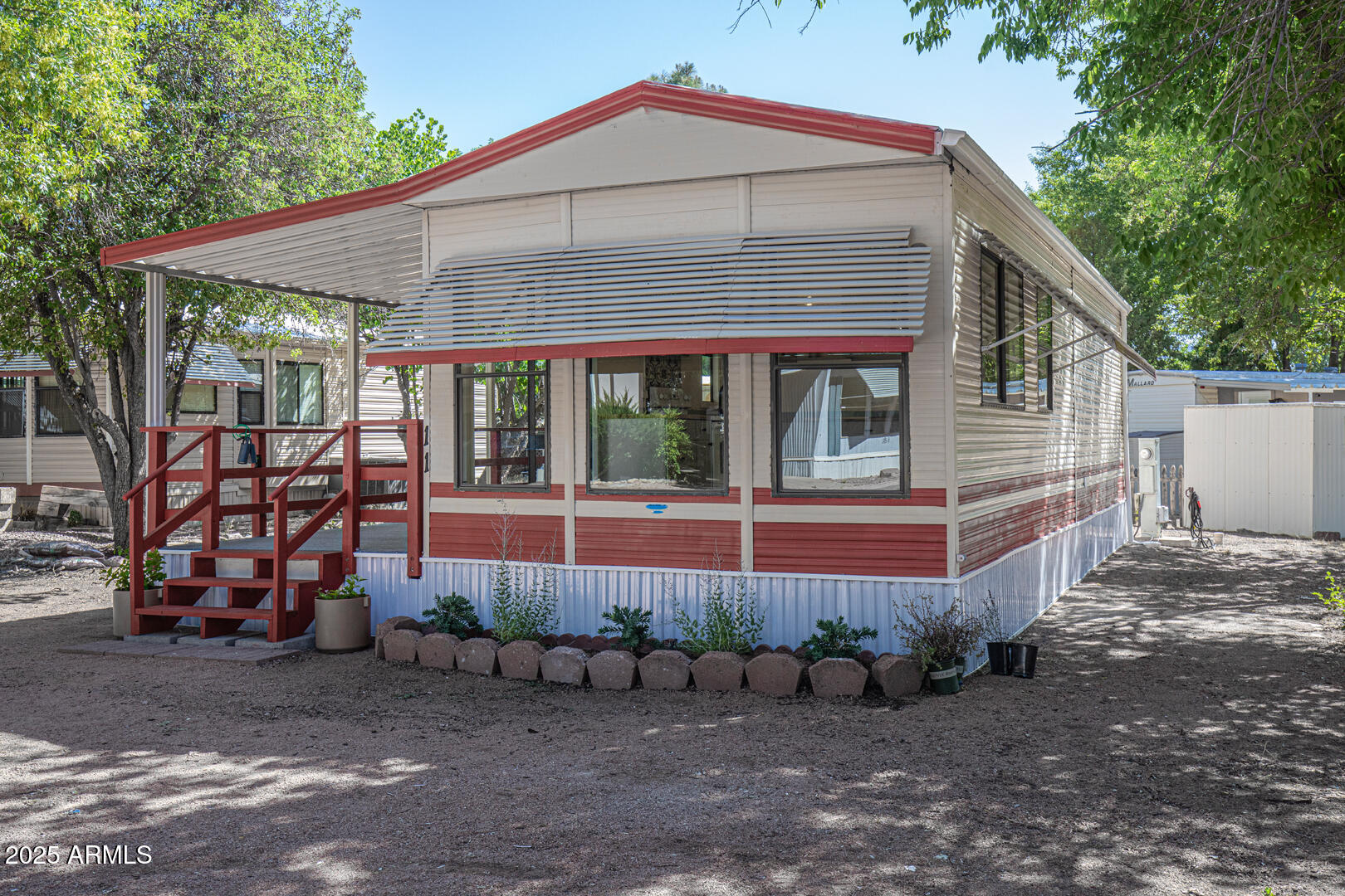 16 North Star Vale Road, Unit 11 Star Valley, AZ 85541 - Photo 3 of 24 a front view of a house with garden