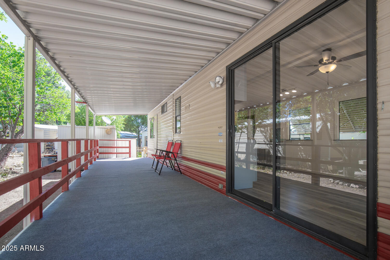 16 North Star Vale Road, Unit 11 Star Valley, AZ 85541 - Photo 6 of 24 a view of a porch with wooden floor and iron stairs