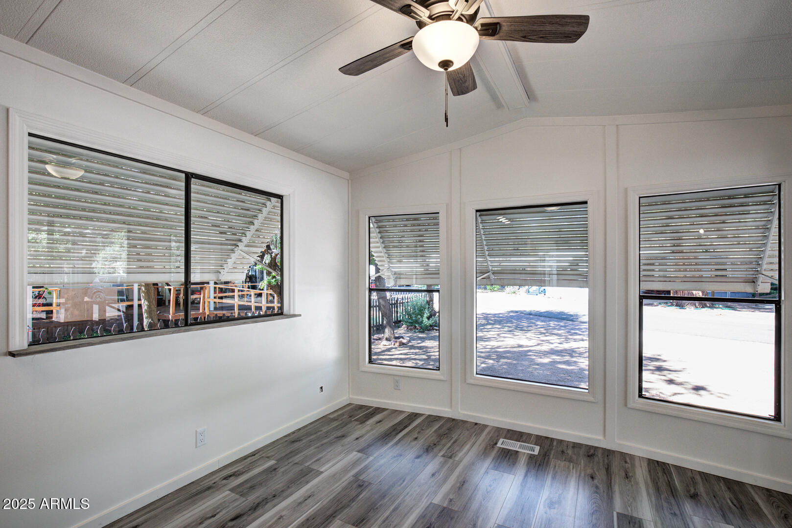 16 North Star Vale Road, Unit 11 Star Valley, AZ 85541 - Photo 8 of 24 a view of an empty room with a window and wooden floor