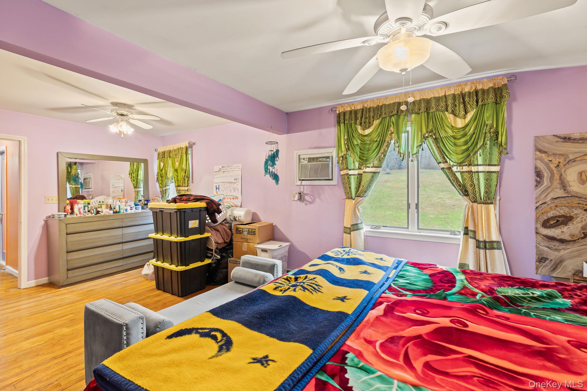 11 Cross Creek Road Cold Spring, NY 10516 - Photo 23 of 43 Bedroom with ceiling fan, wood finished floors, and a wall mounted AC