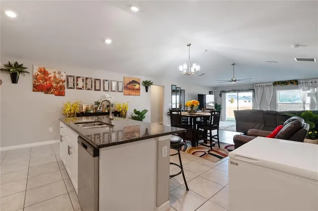 a living room with furniture or couch and a large window