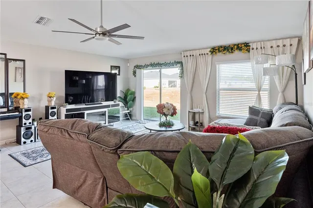 a bedroom with a bed mirror and a window