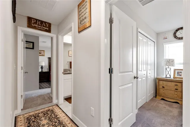 a bathroom with a granite countertop toilet sink and shower curtain