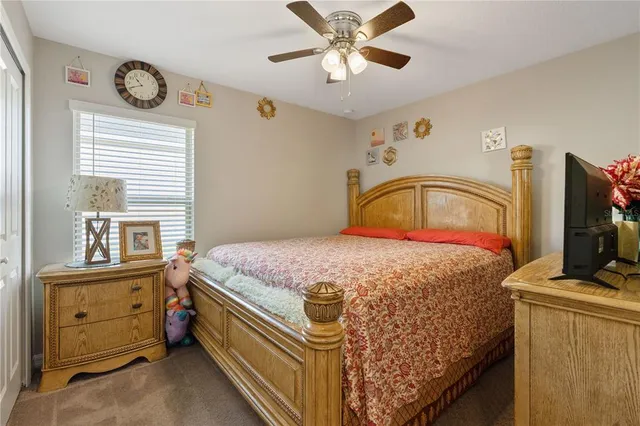 a bathroom with a granite countertop toilet sink and a mirror
