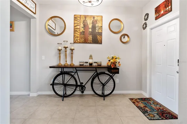 a view of entryway with wooden floor and wall clock