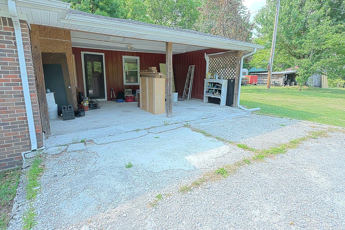 2779 Dale Ridge Road Dowelltown, TN 37059 - Photo 17 of 20 a view of a house with backyard and garage