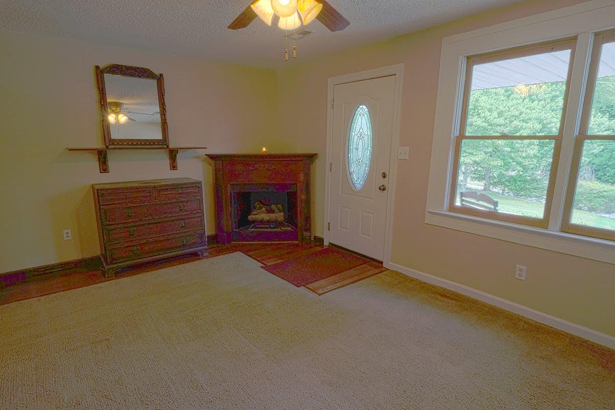 2779 Dale Ridge Road Dowelltown, TN 37059 - Photo 4 of 20 a view of empty room with fireplace and fan