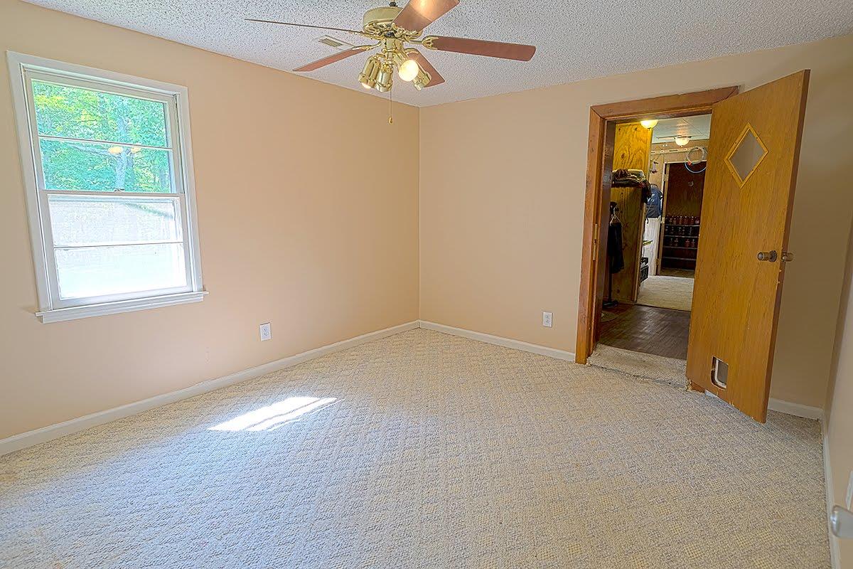 2779 Dale Ridge Road Dowelltown, TN 37059 - Photo 10 of 20 an empty room with closet and a chandelier fan