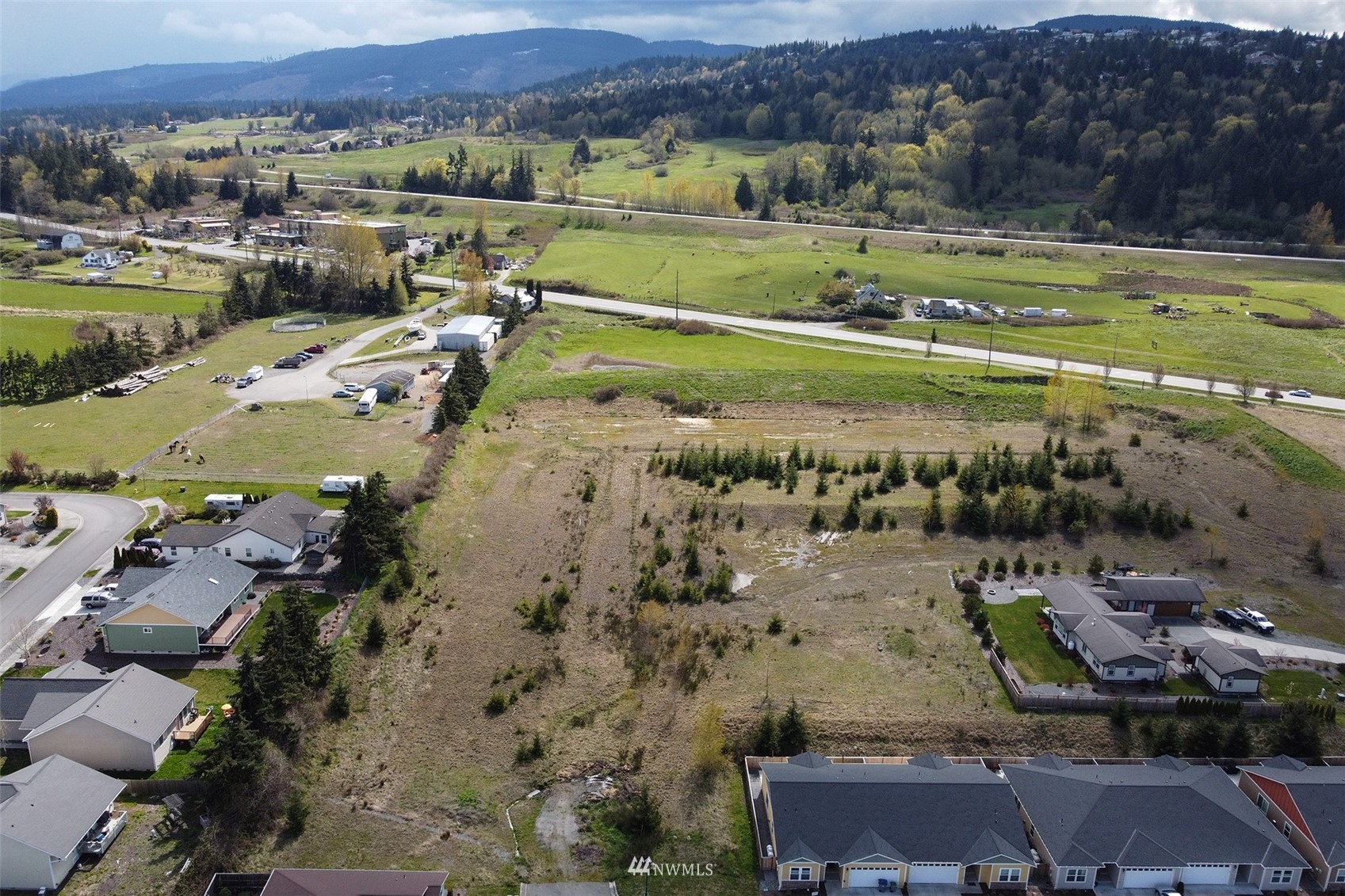 9999 Stratus Loop Sequim, WA 98382 - Photo 35 of 40 an aerial view of a city with mountains