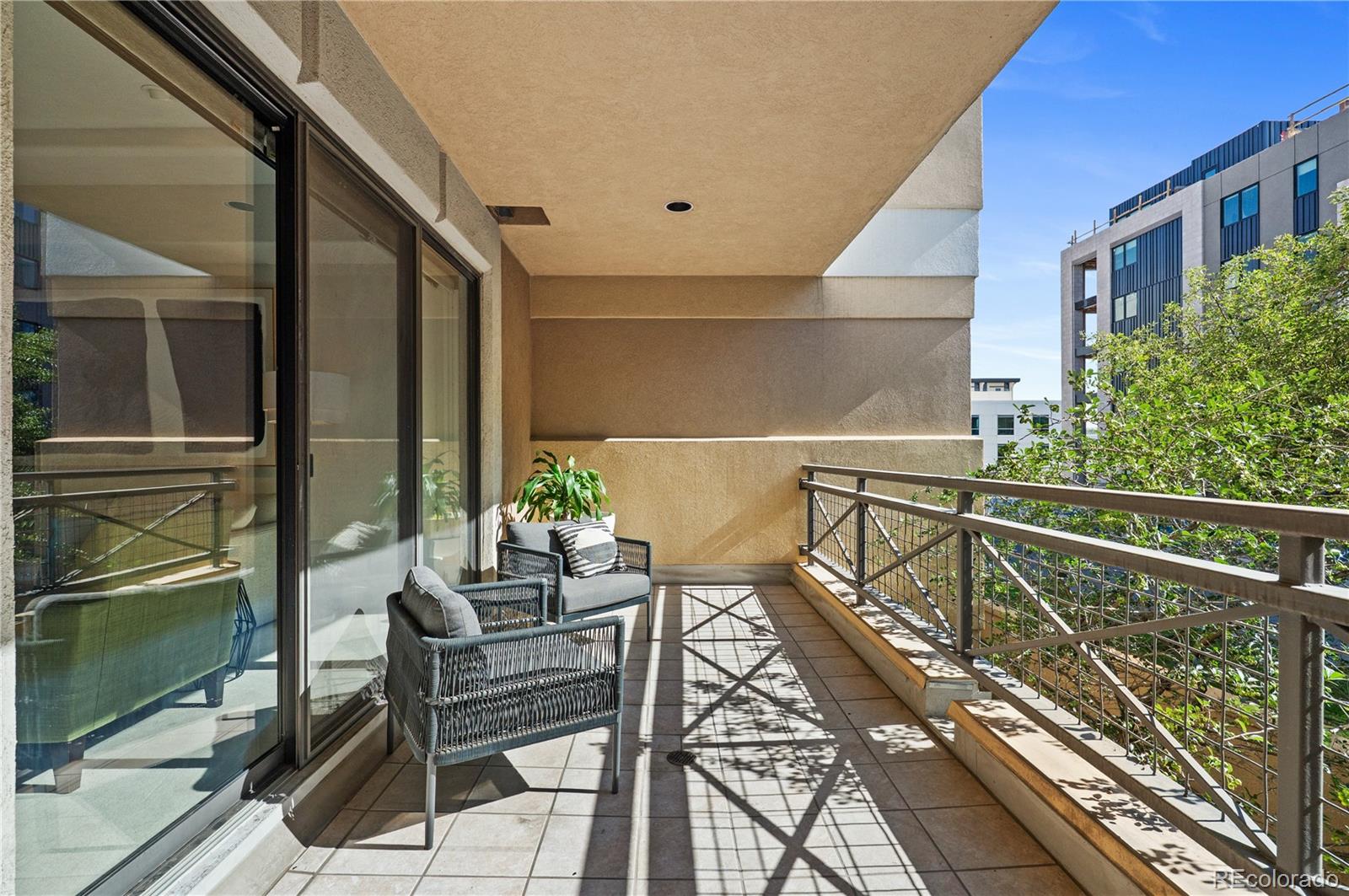 180 Cook Street, Unit 203 Denver, CO 80206 - Photo 31 of 44 a balcony view with a large window and sitting space