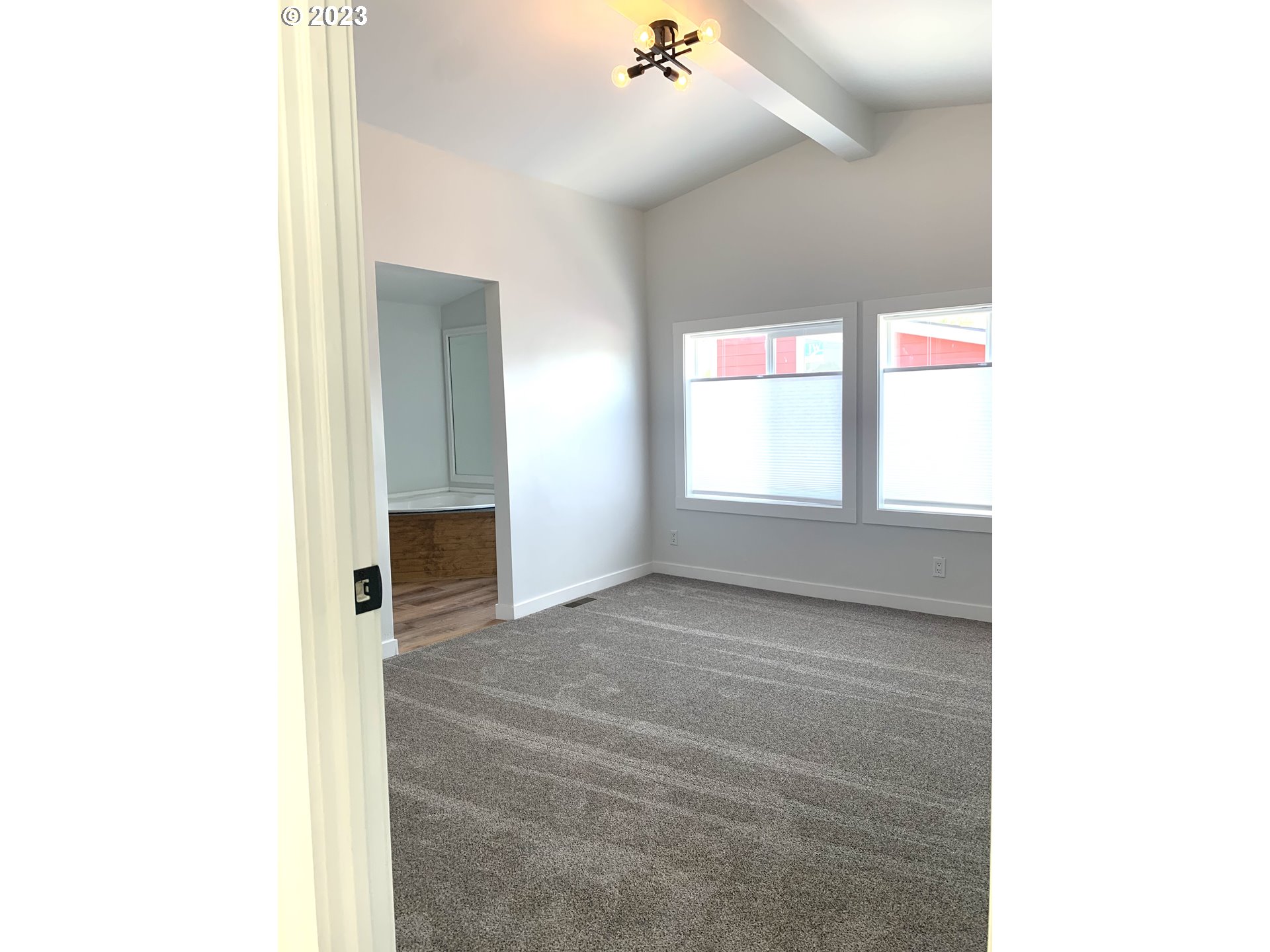 620 Southwest Mildred Avenue Enterprise, OR 97828 - Photo 16 of 26 a view of an empty room with a window and a fireplace