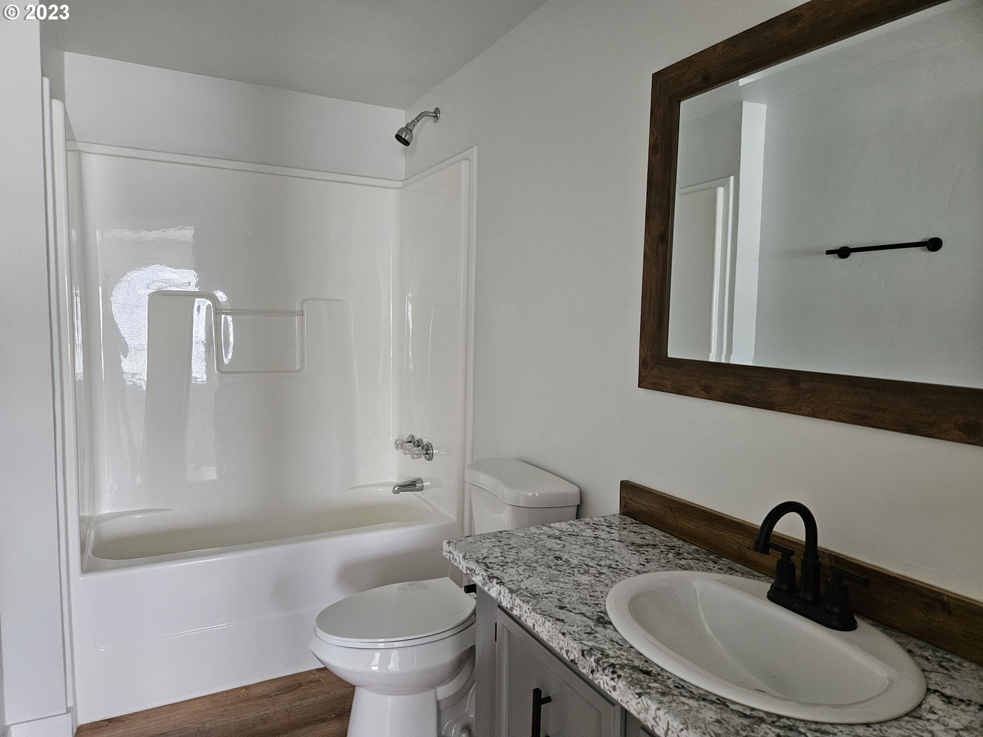 620 Southwest Mildred Avenue Enterprise, OR 97828 - Photo 20 of 26 a bathroom with a granite countertop sink toilet and shower