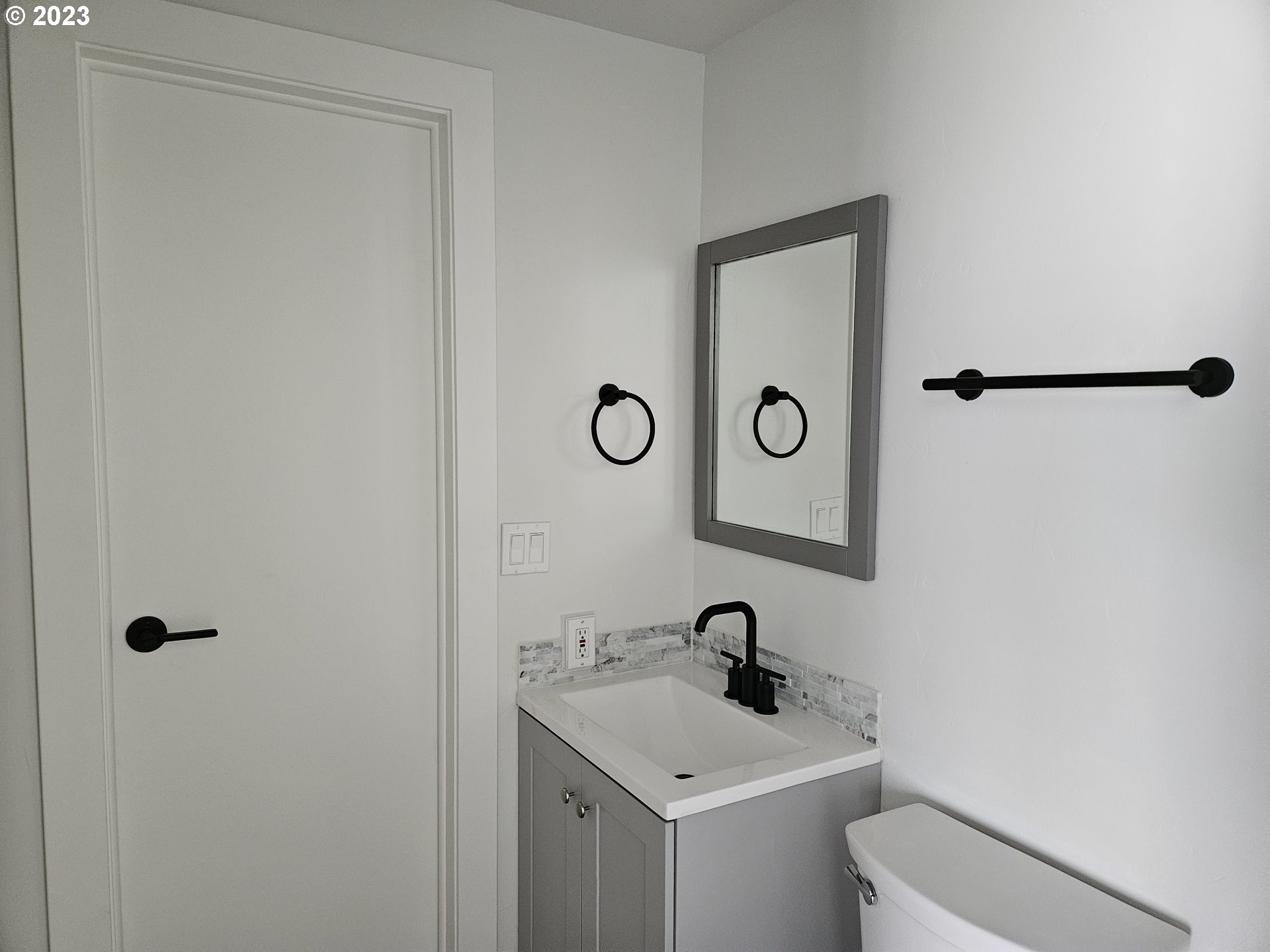 620 Southwest Mildred Avenue Enterprise, OR 97828 - Photo 22 of 26 a bathroom with a toilet sink and mirror