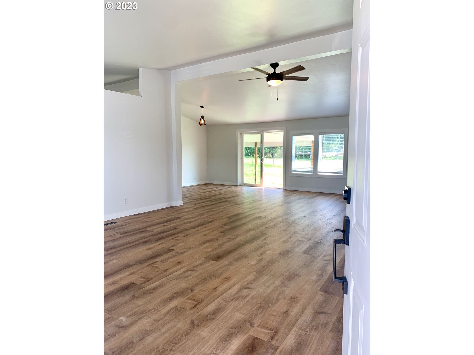 620 Southwest Mildred Avenue Enterprise, OR 97828 - Photo 5 of 26 a view of an empty room with wooden floor