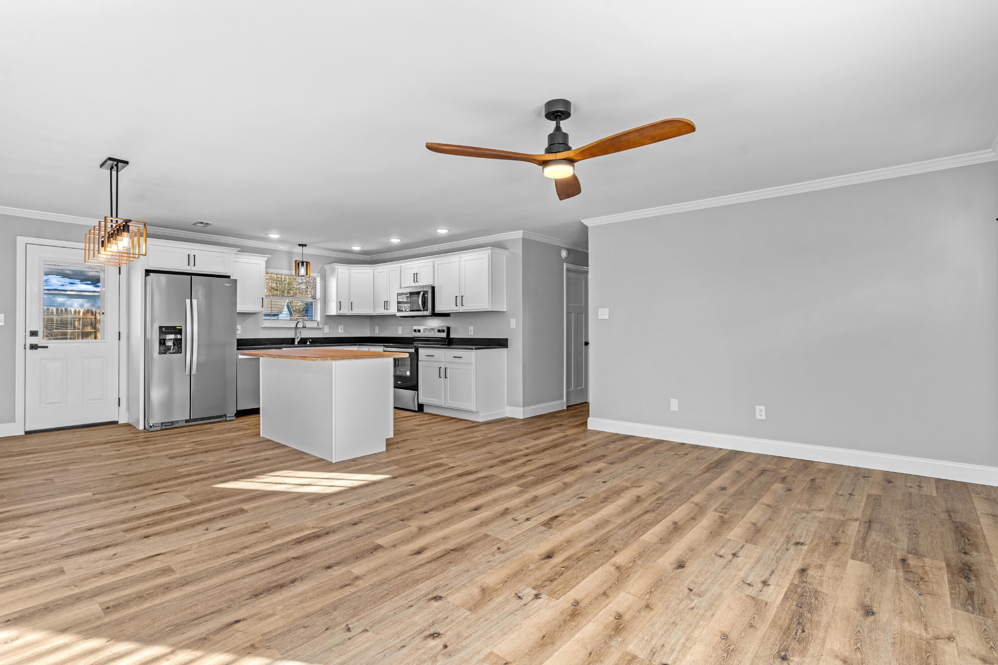 208 No Pone Road Northwest Georgetown, TN 37336 - Photo 3 of 17 a view of a kitchen with a sink and wooden floor