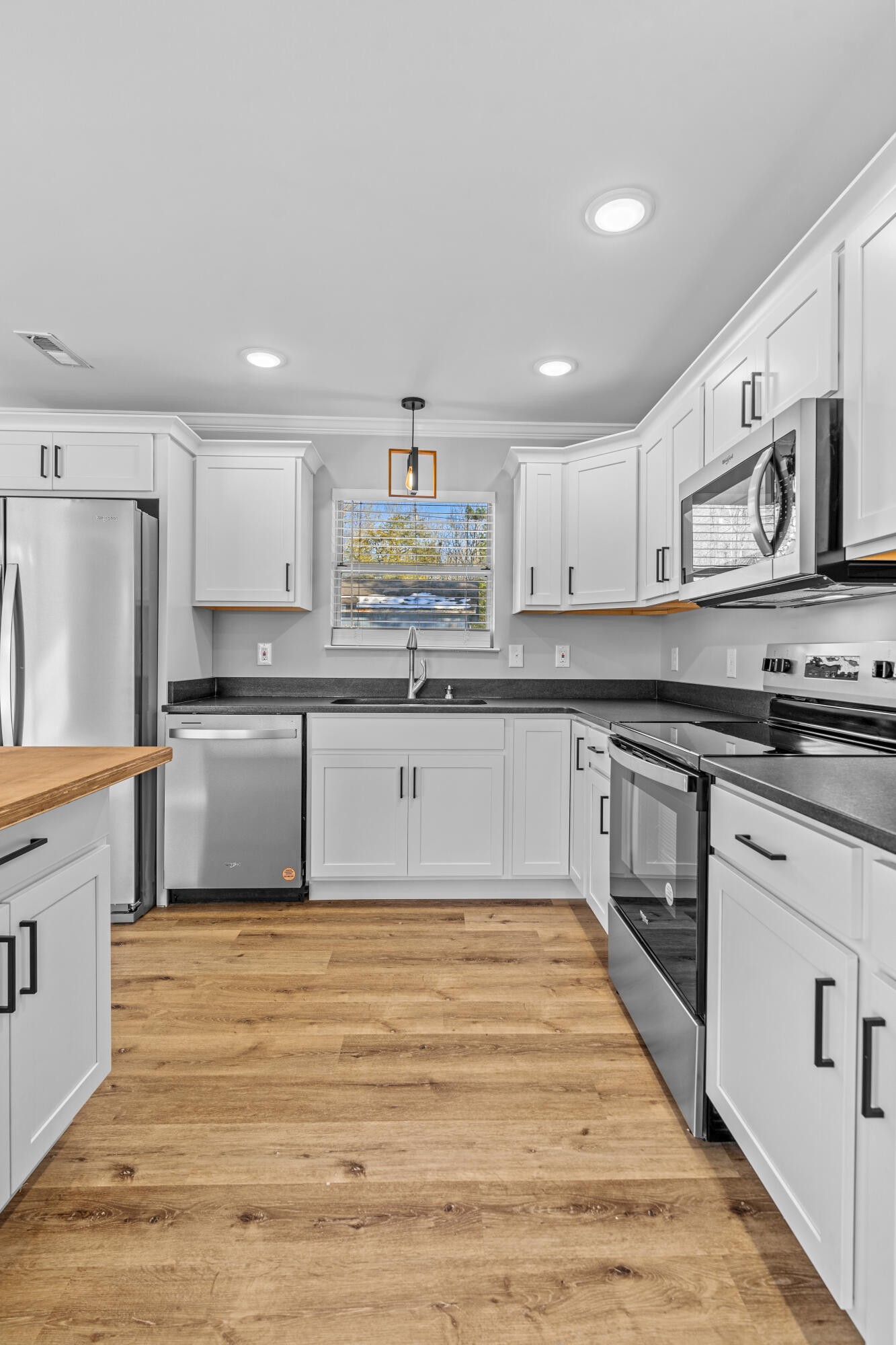 208 No Pone Road Northwest Georgetown, TN 37336 - Photo 5 of 17 a kitchen with stainless steel appliances granite countertop a stove a sink and a refrigerator