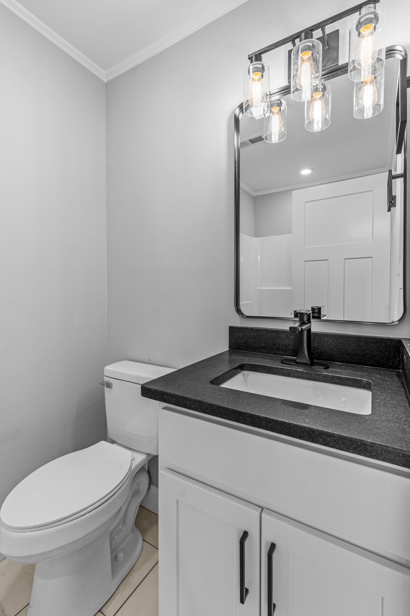 208 No Pone Road Northwest Georgetown, TN 37336 - Photo 8 of 17 a bathroom with a granite countertop toilet and a sink