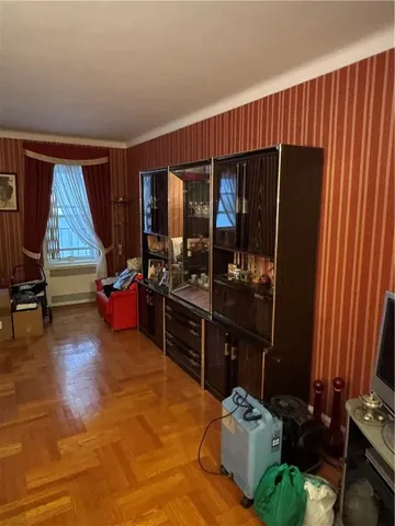 a living room with furniture rug and window