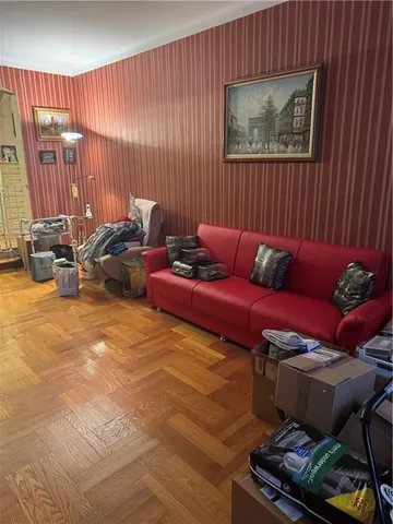 a living room with furniture and a gate