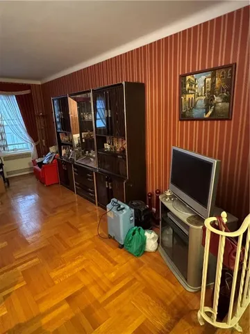 a bedroom with furniture and flat screen tv