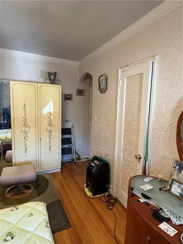 a bedroom with a bed and a mirror