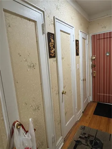 a bedroom with a bed and a mirror