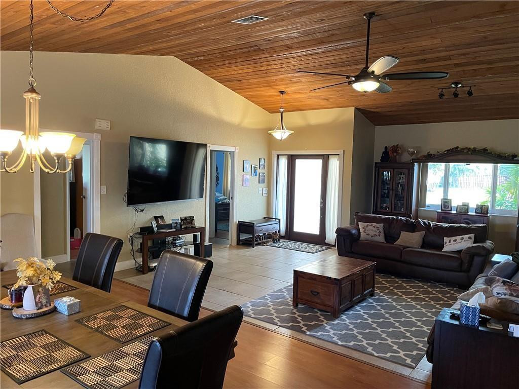 8581 Southwest 27th Place Davie, FL 33328 - Photo 5 of 10 a living room with furniture and a flat screen tv