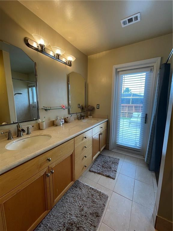 8581 Southwest 27th Place Davie, FL 33328 - Photo 7 of 10 a spacious bathroom with a double vanity sink and a mirror