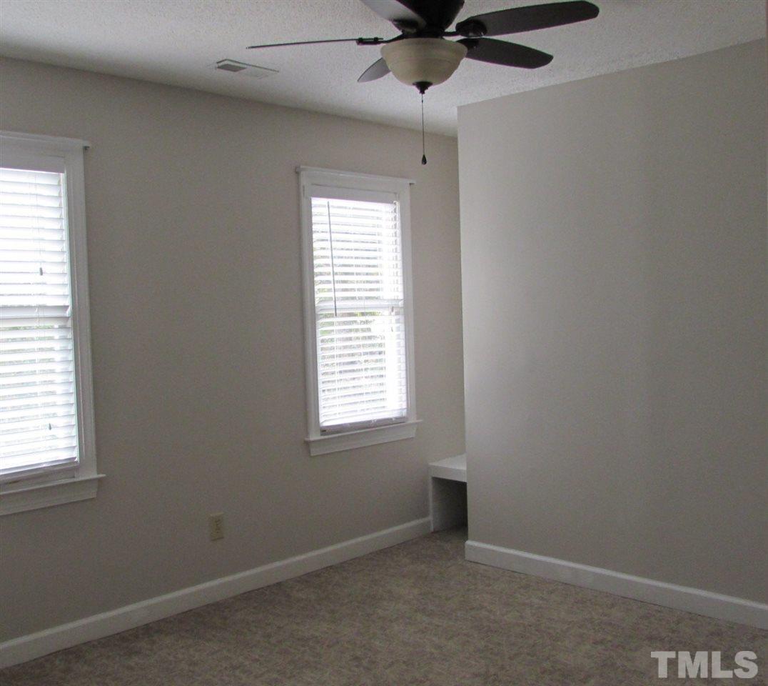 9517 Center Cross Court Raleigh, NC 27617 - Photo 15 of 24 Large secondary bedroom with new carpet and ceiling fan.