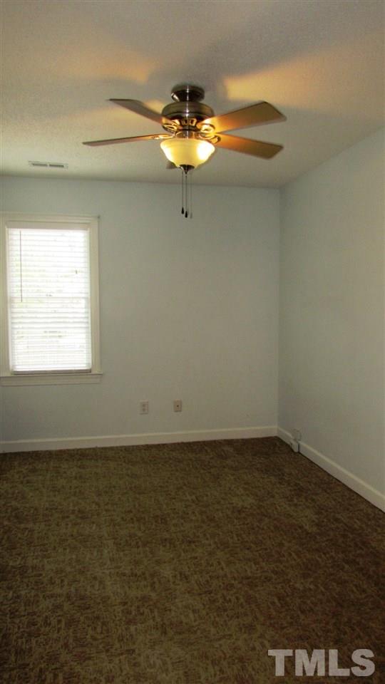 9517 Center Cross Court Raleigh, NC 27617 - Photo 16 of 24 Additional bedroom with new carpet and ceiling fan.