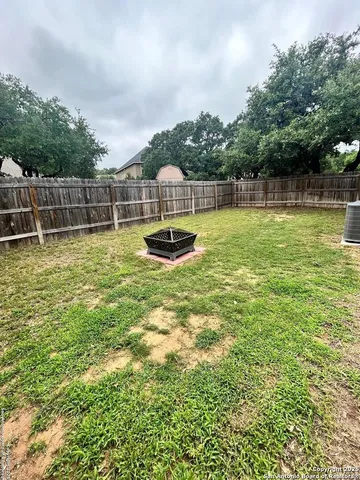 a view of a backyard with swimming pool