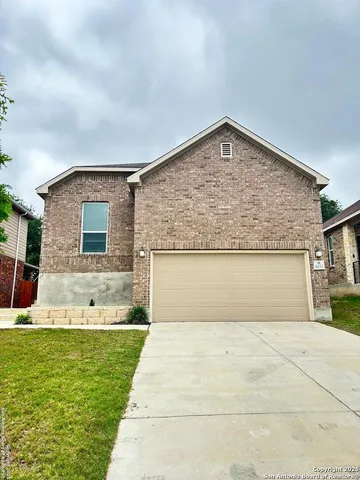 a view of house with swimming pool