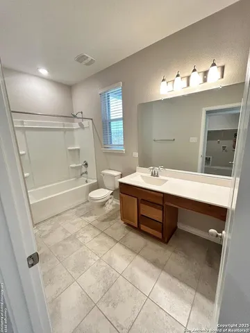 a bathroom with a sink double vanity and a mirror