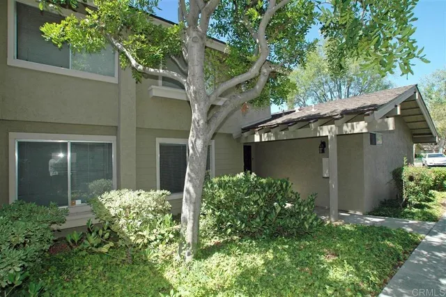 front view of a house with a small yard