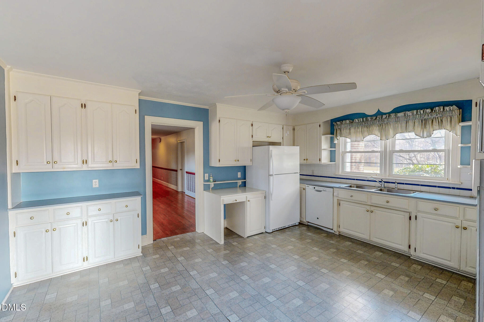 8758 Hurdle Mills Road Hurdle Mills, NC 27541 - Photo 11 of 53 a kitchen with cabinets and window