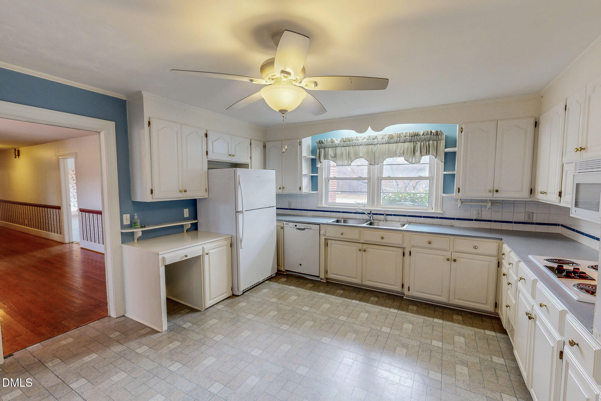 8758 Hurdle Mills Road Hurdle Mills, NC 27541 - Photo 19 of 53 a kitchen with a white cabinets and window