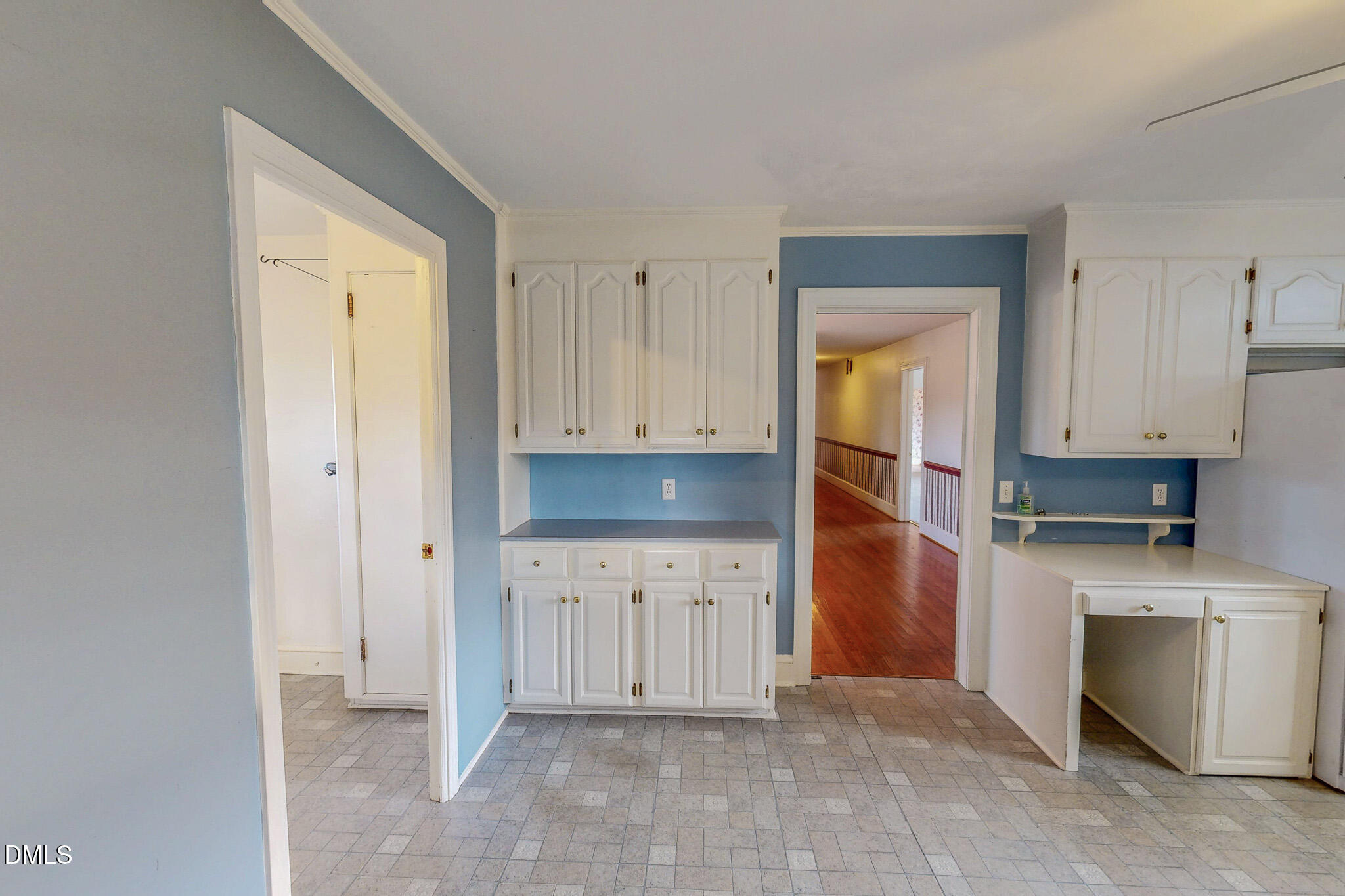 8758 Hurdle Mills Road Hurdle Mills, NC 27541 - Photo 20 of 53 a kitchen with white cabinets