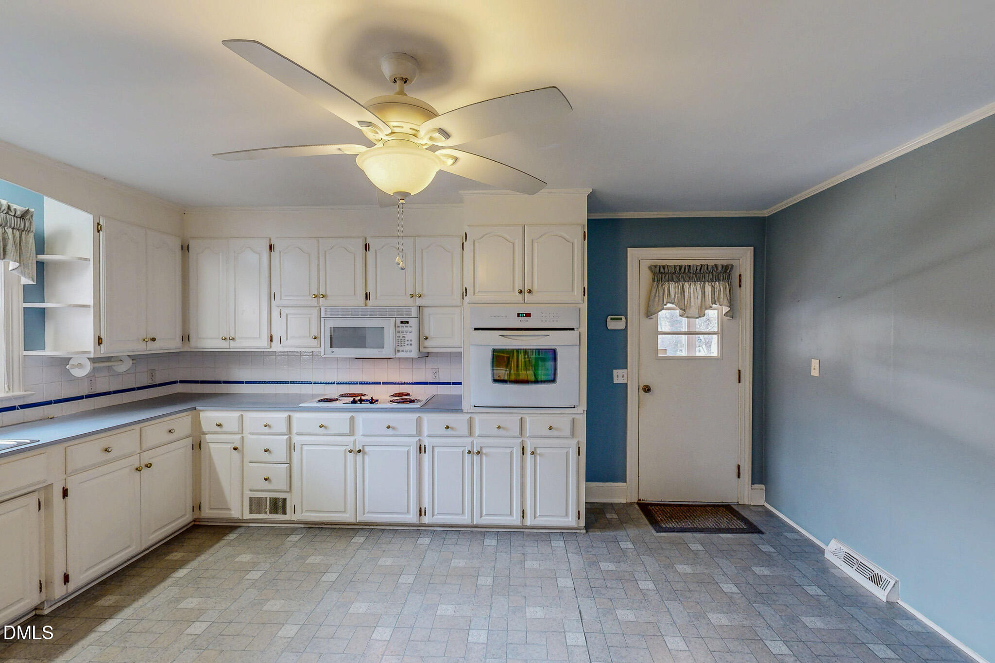 8758 Hurdle Mills Road Hurdle Mills, NC 27541 - Photo 22 of 53 a kitchen with a cabinets and chandelier
