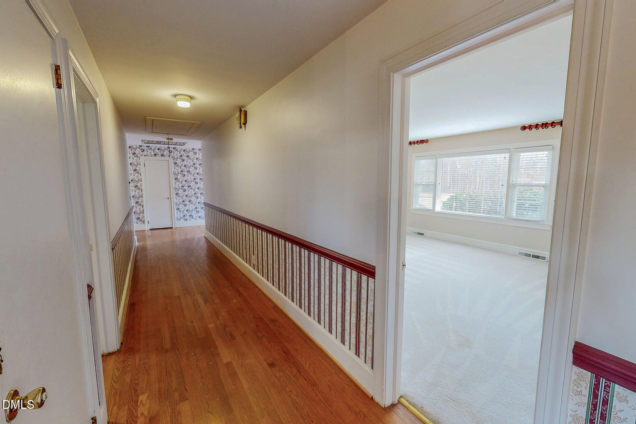 8758 Hurdle Mills Road Hurdle Mills, NC 27541 - Photo 26 of 53 a view of hallway with wooden floor