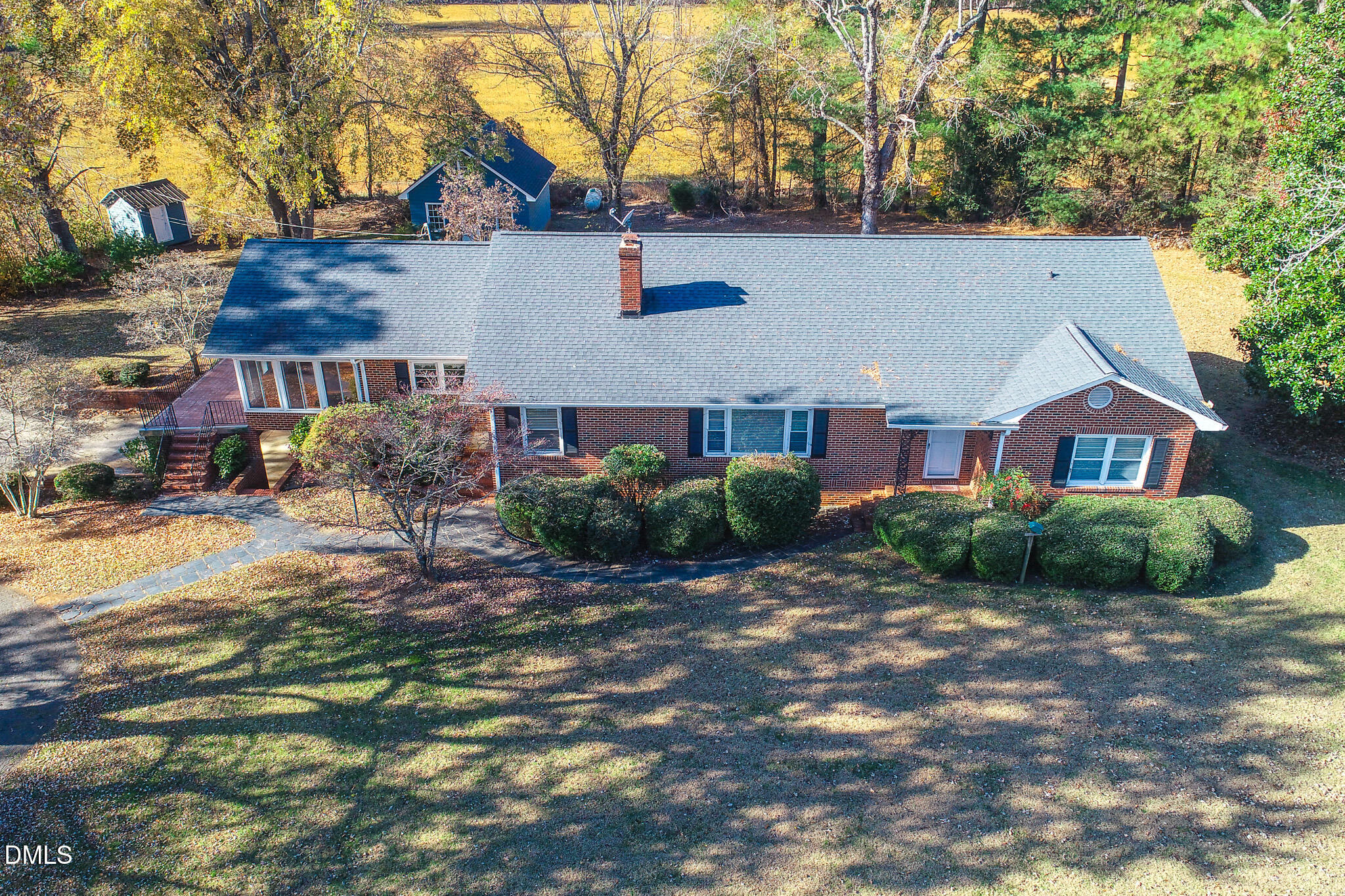 8758 Hurdle Mills Road Hurdle Mills, NC 27541 - Photo 29 of 53 a view of a house with a yard