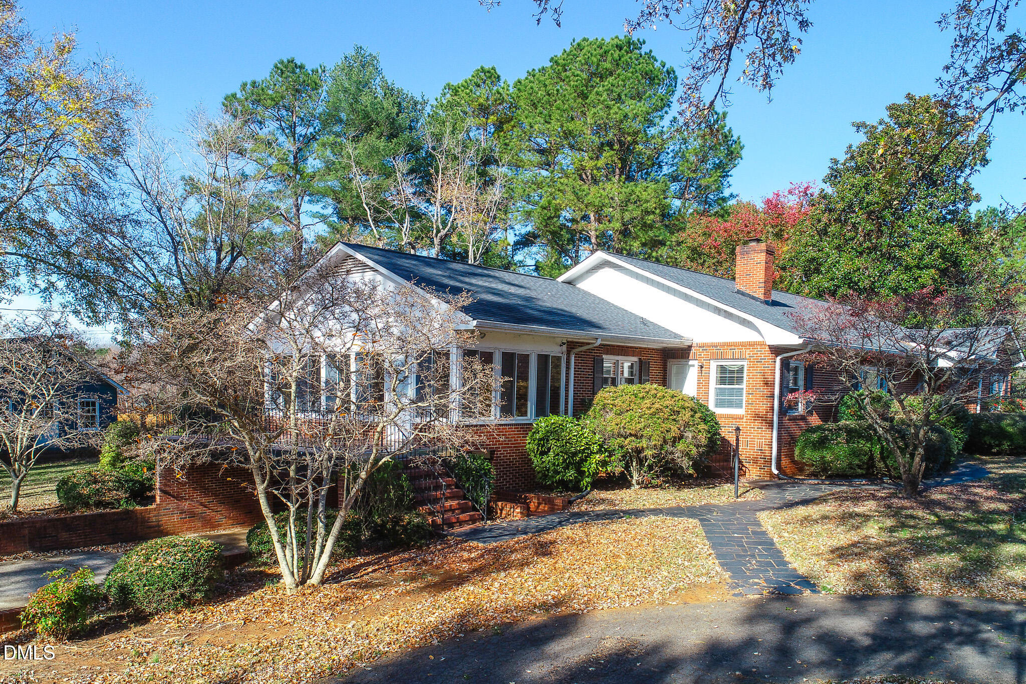 8758 Hurdle Mills Road Hurdle Mills, NC 27541 - Photo 30 of 53 a view of a house with potted plants and large trees