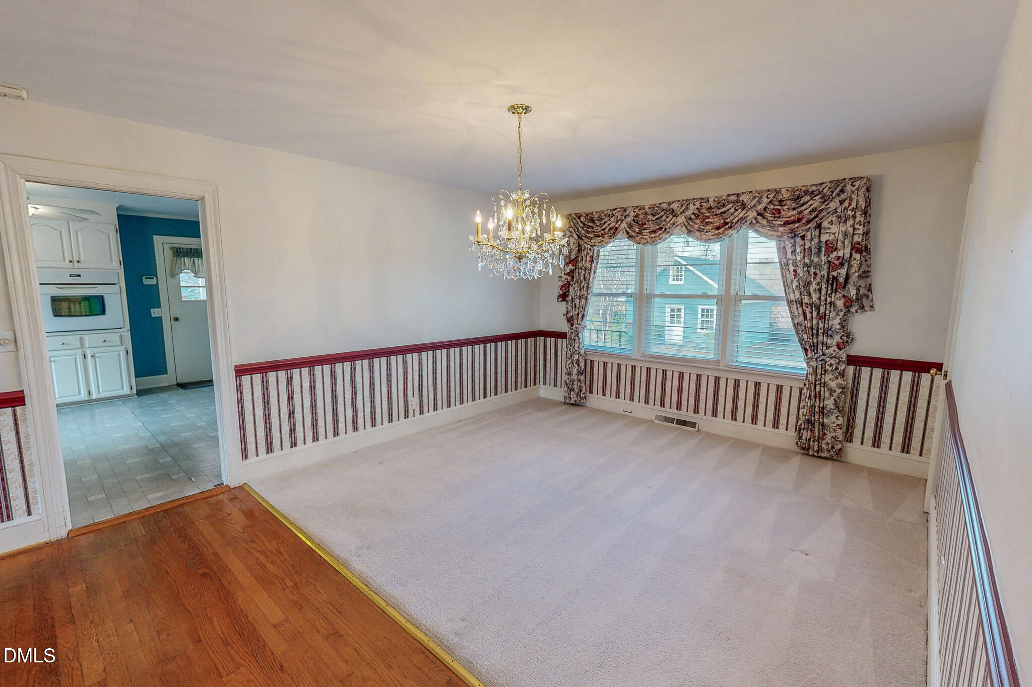 8758 Hurdle Mills Road Hurdle Mills, NC 27541 - Photo 3 of 53 a view of a room with stairs and a floor to ceiling window
