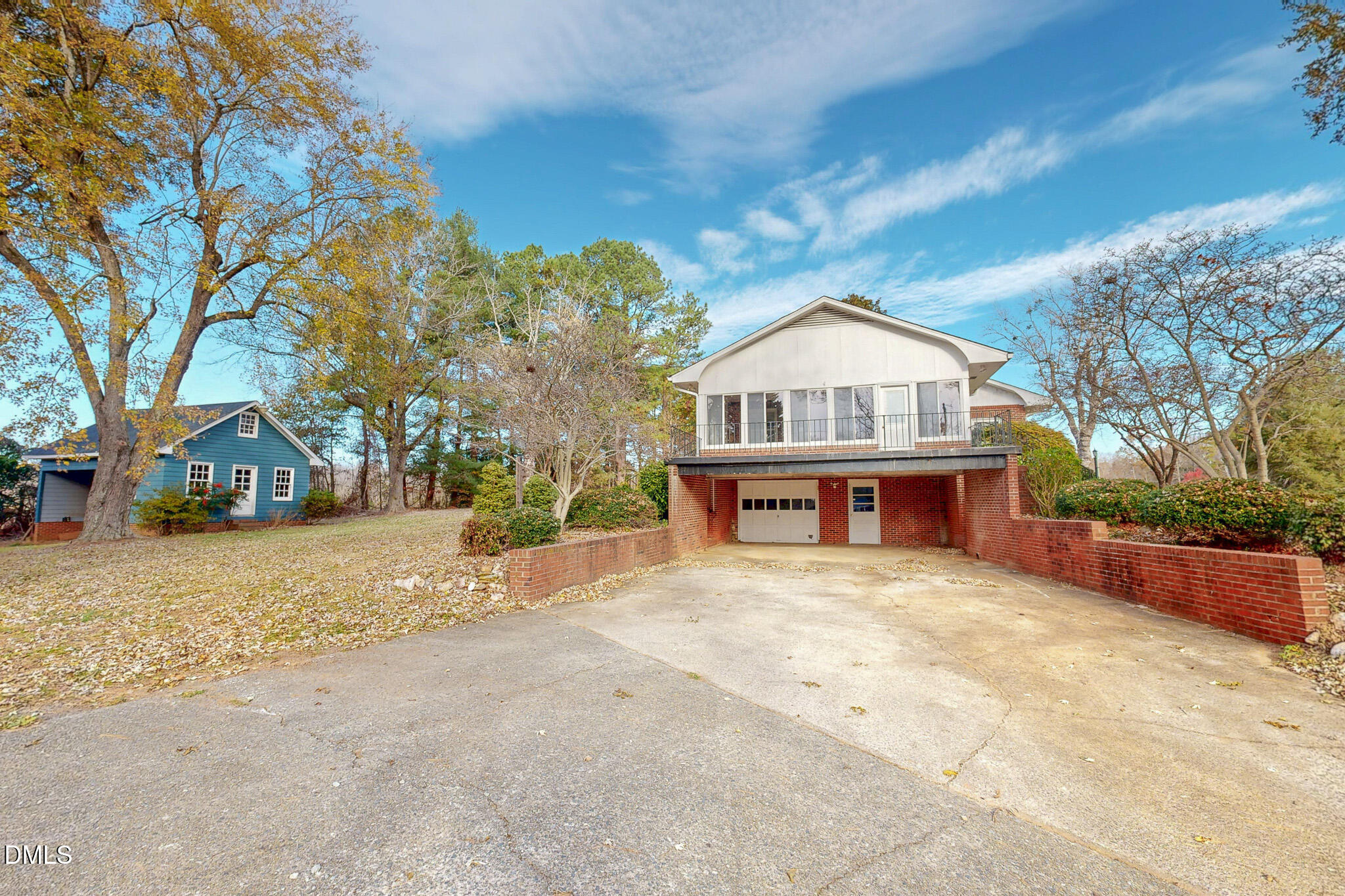 8758 Hurdle Mills Road Hurdle Mills, NC 27541 - Photo 31 of 53 a front view of a house with a yard and garage