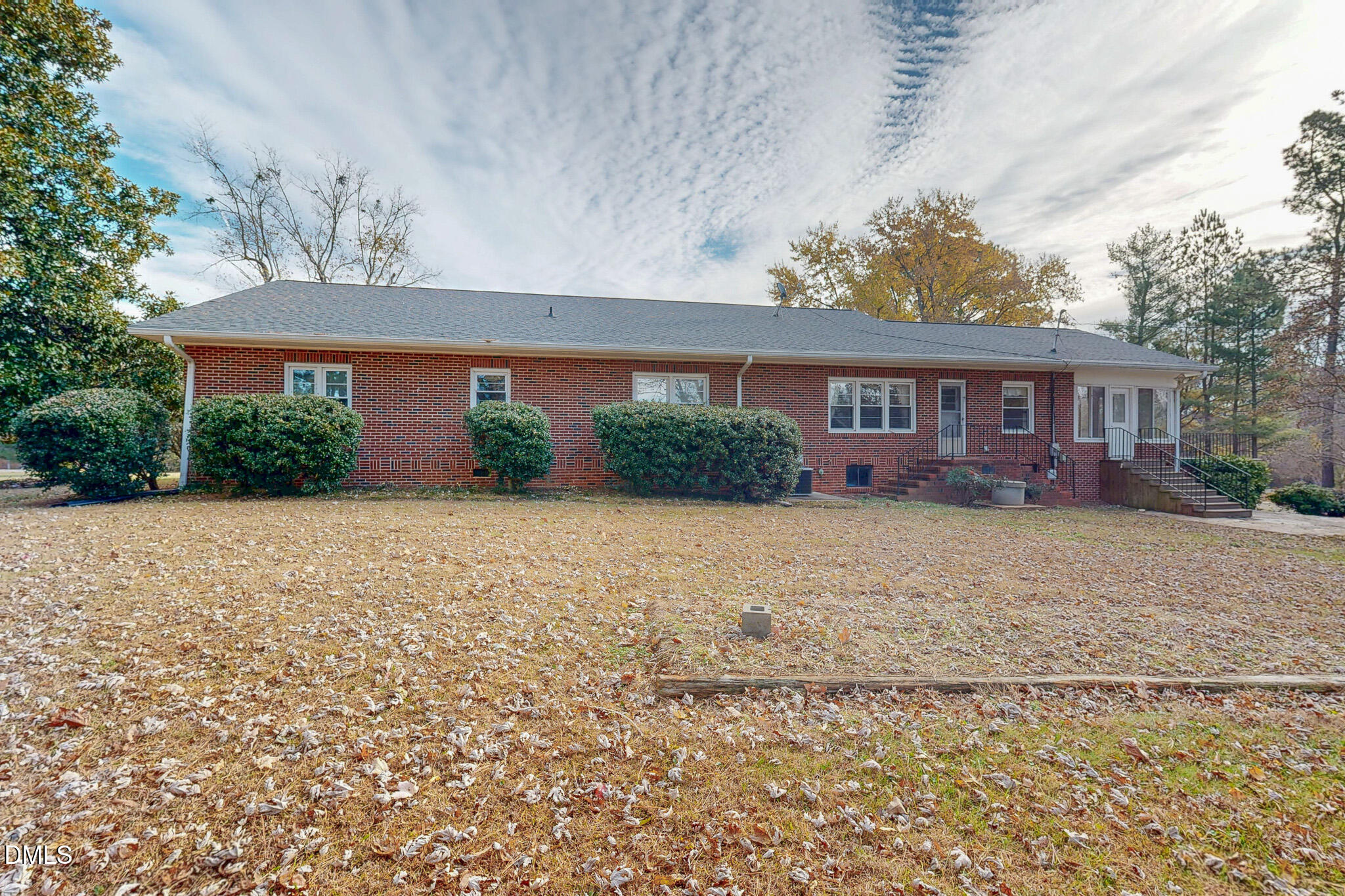8758 Hurdle Mills Road Hurdle Mills, NC 27541 - Photo 32 of 53 a front view of a house with a yard and potted plants