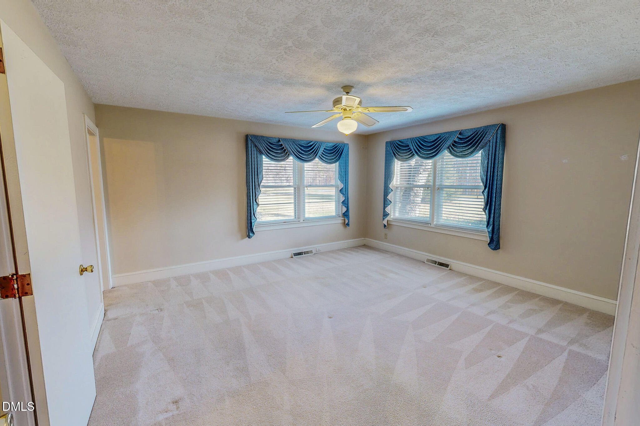 8758 Hurdle Mills Road Hurdle Mills, NC 27541 - Photo 36 of 53 an empty room with windows and closet