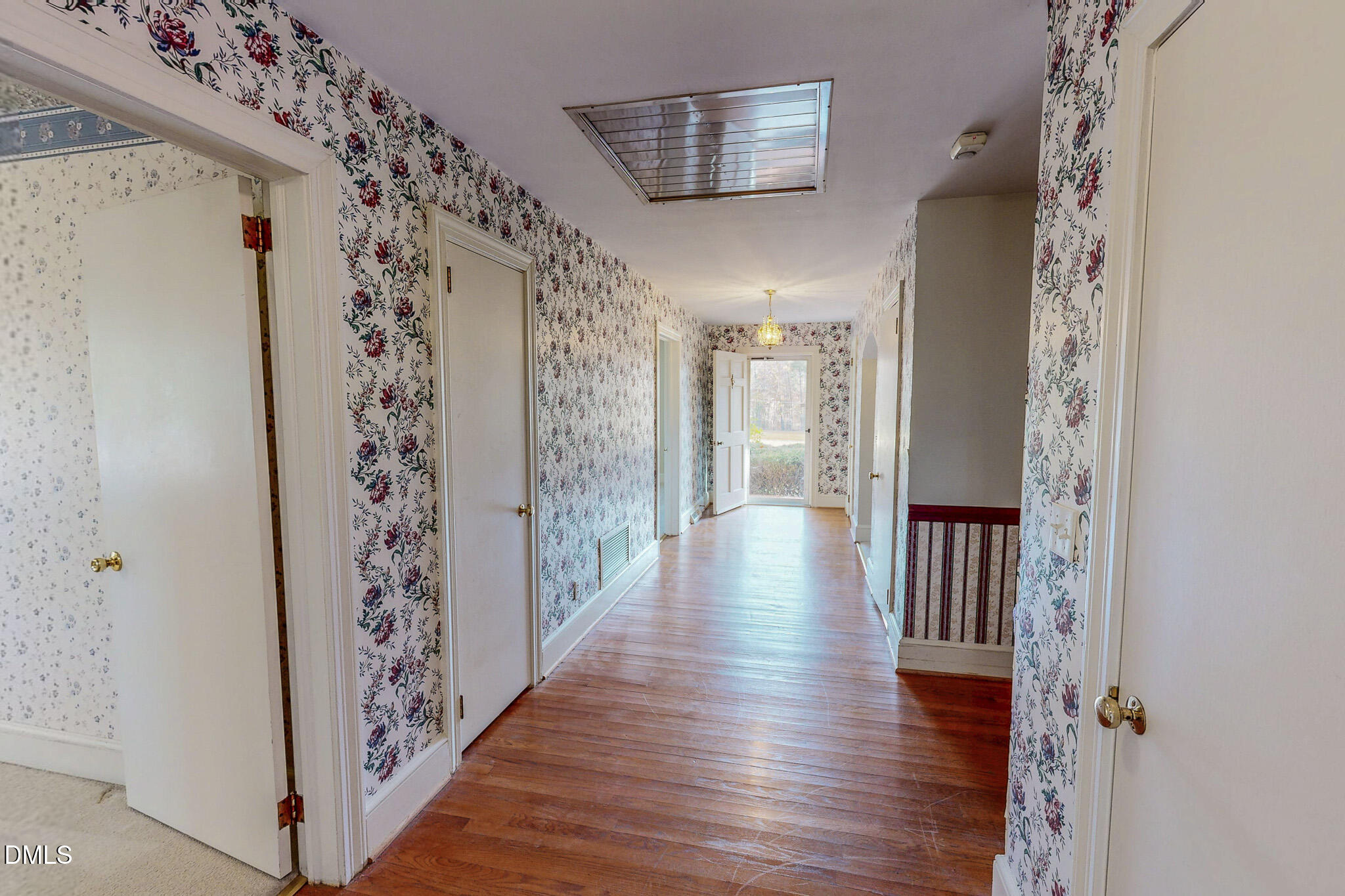 8758 Hurdle Mills Road Hurdle Mills, NC 27541 - Photo 42 of 53 a view of a hallway with wooden floor and entryway