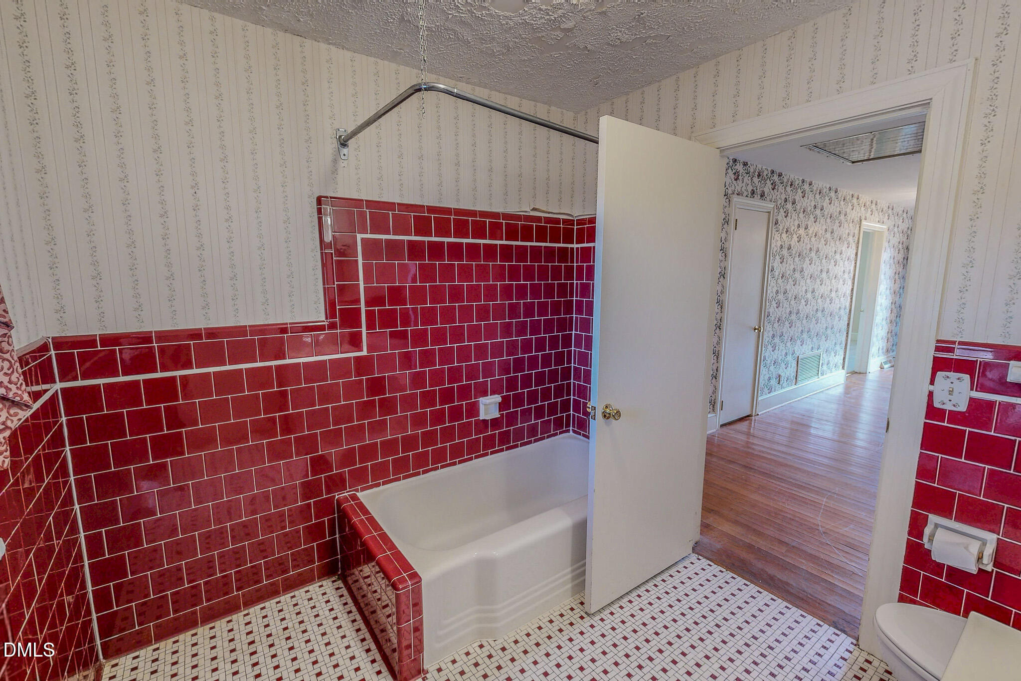 8758 Hurdle Mills Road Hurdle Mills, NC 27541 - Photo 47 of 53 a bathroom with a toilet a sink and shower