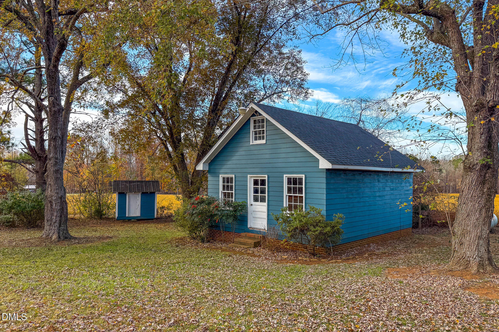 8758 Hurdle Mills Road Hurdle Mills, NC 27541 - Photo 6 of 53 a house with trees in the background