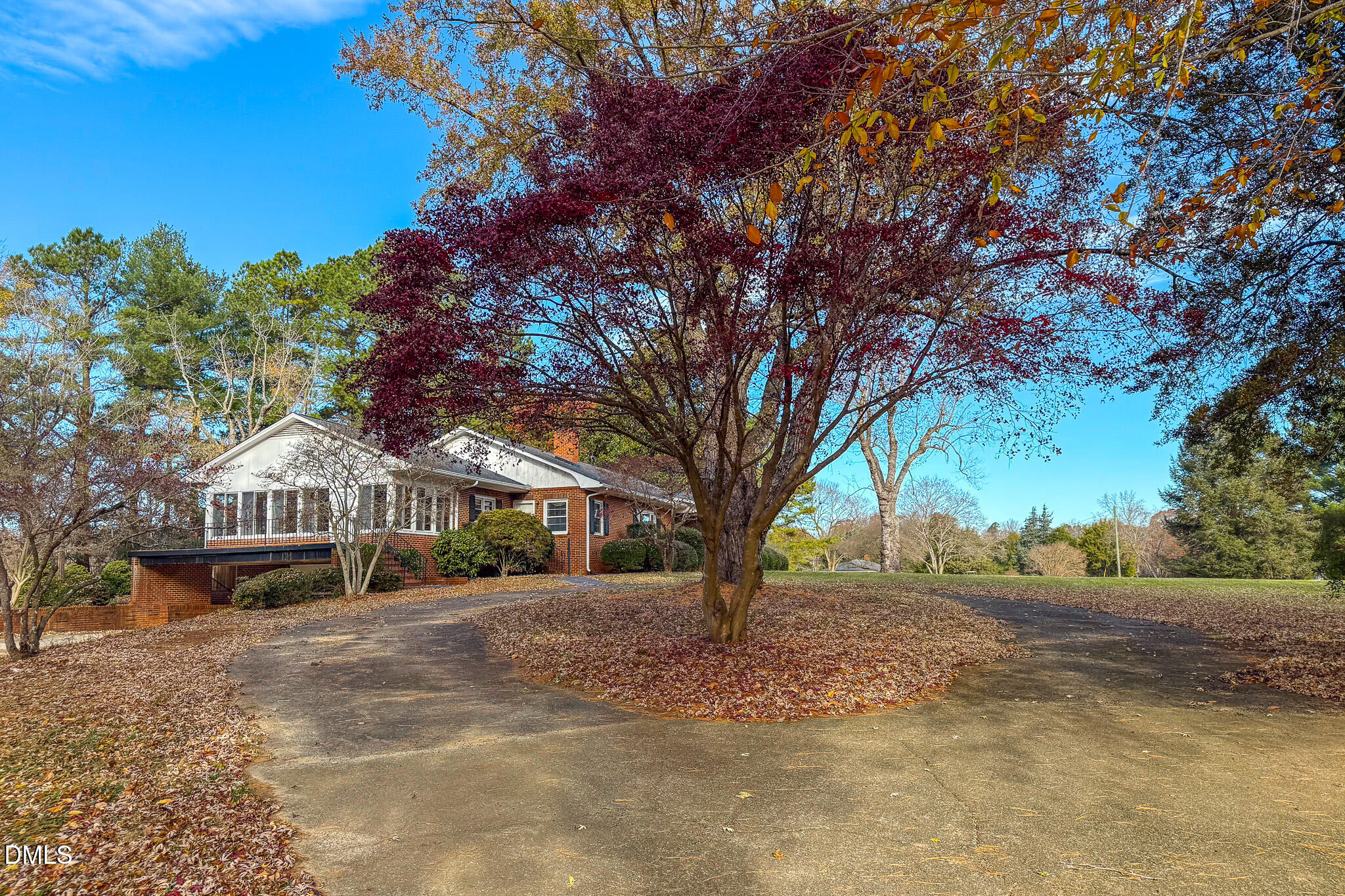 8758 Hurdle Mills Road Hurdle Mills, NC 27541 - Photo 7 of 53 a view of large house with a yard and a large tree
